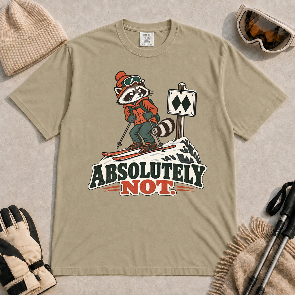 Khaki tee featuring a wary raccoon skier beside a double black diamond trail sign above the phrase “Absolutely Not.”