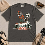 Pepper tee featuring a wary raccoon skier beside a double black diamond trail sign above the phrase “Absolutely Not.”