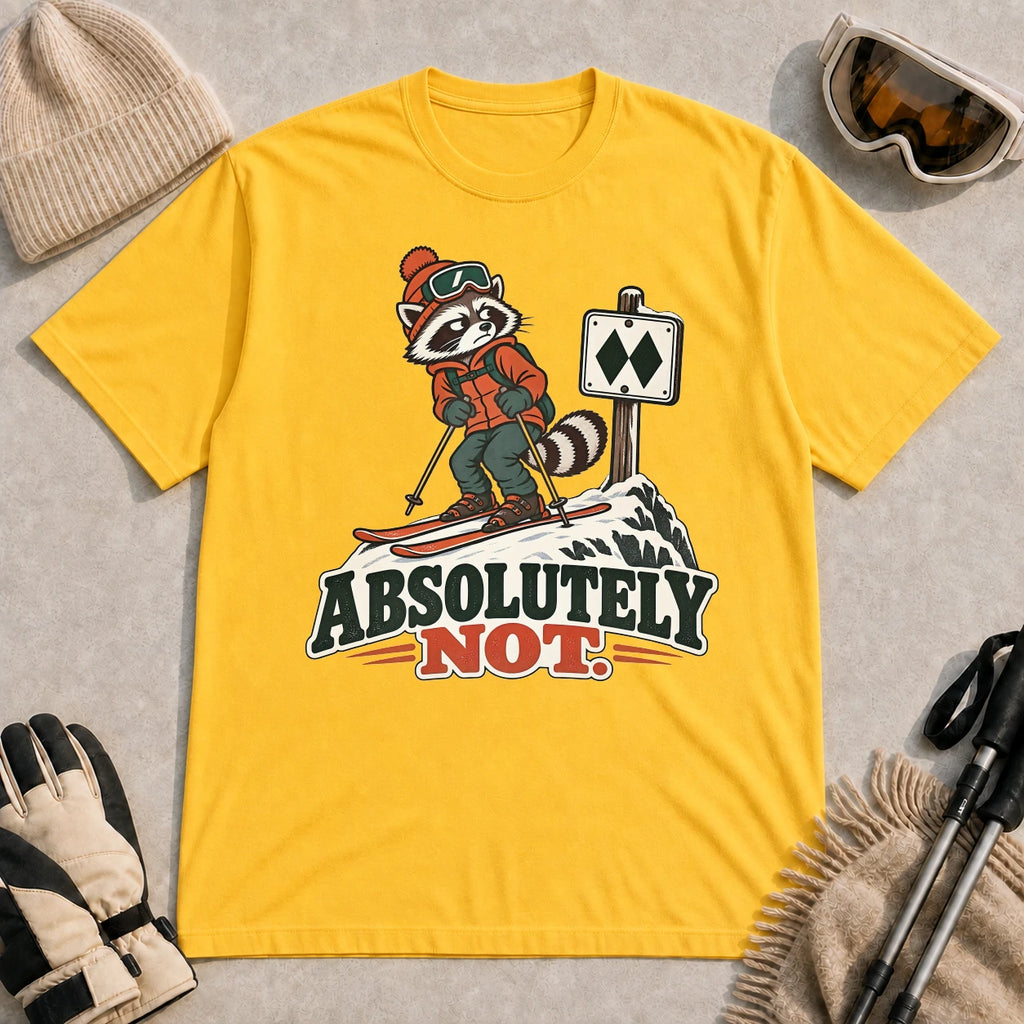 Mustard tee featuring a wary raccoon skier beside a double black diamond trail sign above the phrase “Absolutely Not.”