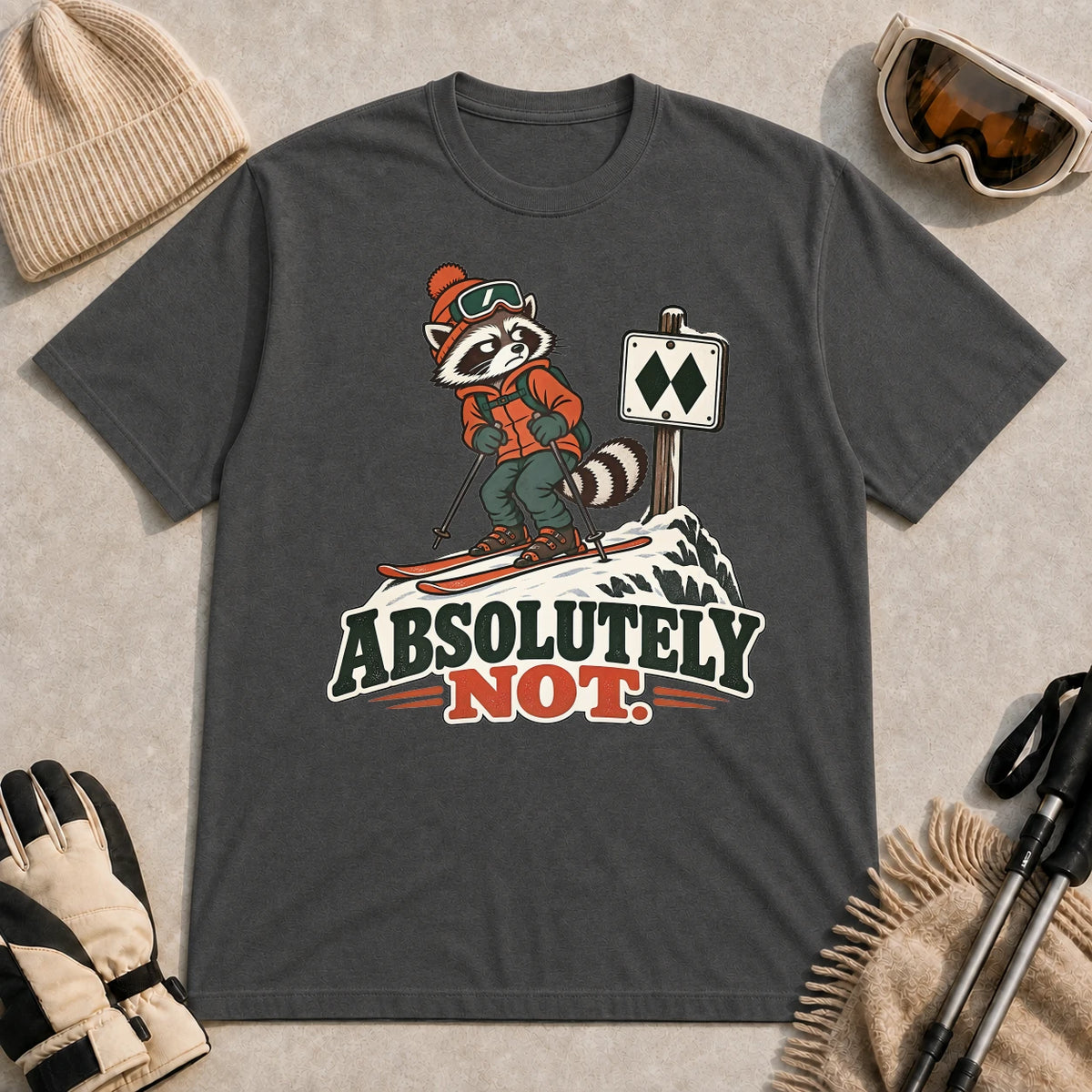 Dark Heather Gray tee featuring a wary raccoon skier beside a double black diamond trail sign above the phrase “Absolutely Not.”