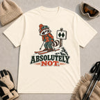 Natural tee featuring a wary raccoon skier beside a double black diamond trail sign above the phrase “Absolutely Not.”