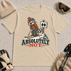 Sand tee featuring a wary raccoon skier beside a double black diamond trail sign above the phrase “Absolutely Not.”
