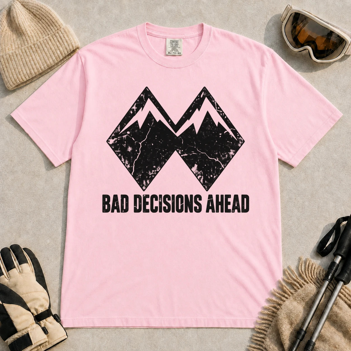 Blossom tee featuring a distressed black double-mountain graphic above the phrase “Bad Decisions Ahead.”