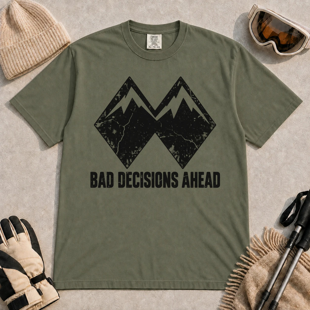 Moss tee featuring a distressed black double-mountain graphic above the phrase “Bad Decisions Ahead.”