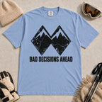 Washed Denim tee featuring a distressed black double-mountain graphic above the phrase “Bad Decisions Ahead.”