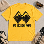 Daisy tee featuring a distressed black double-mountain graphic above the phrase “Bad Decisions Ahead.”