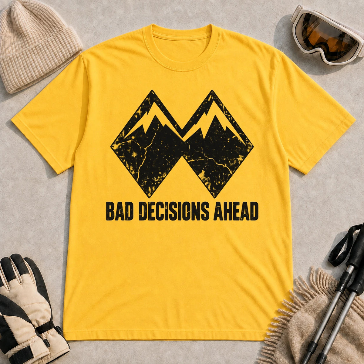 Daisy tee featuring a distressed black double-mountain graphic above the phrase “Bad Decisions Ahead.”