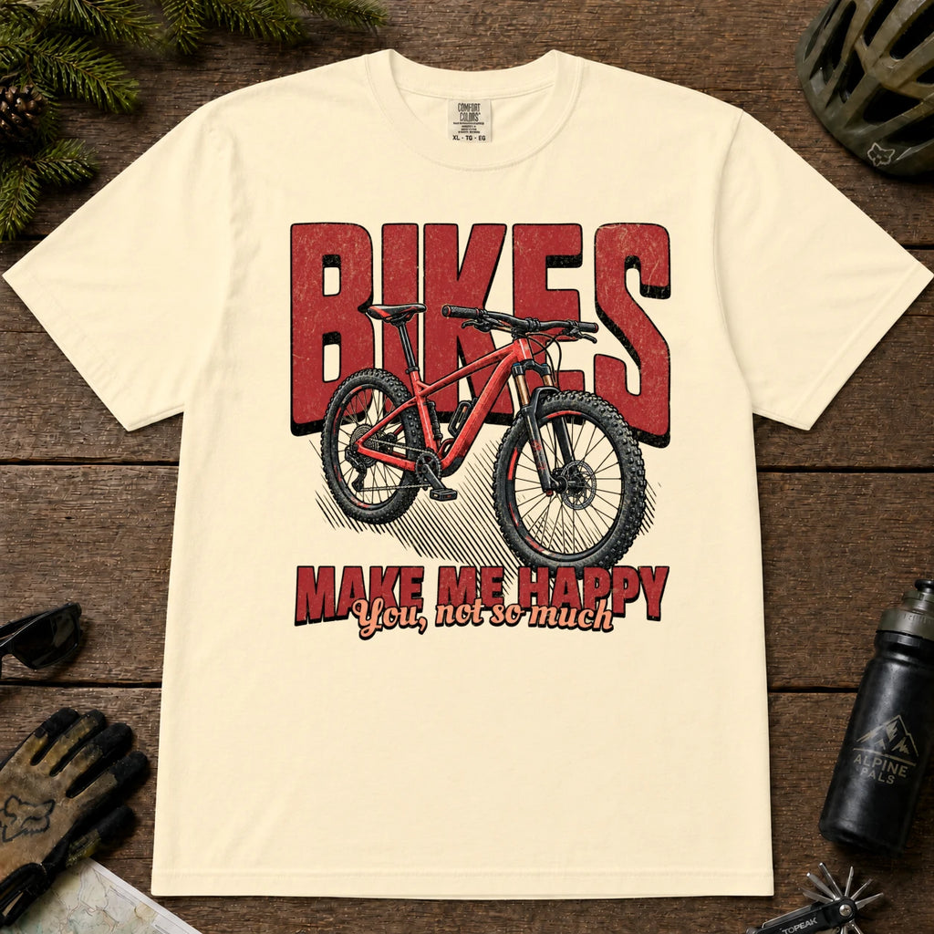 Ivory tee featuring a red mountain bike in front of bold retro “Bikes” lettering with the phrase “Make Me Happy, You Not So Much.”