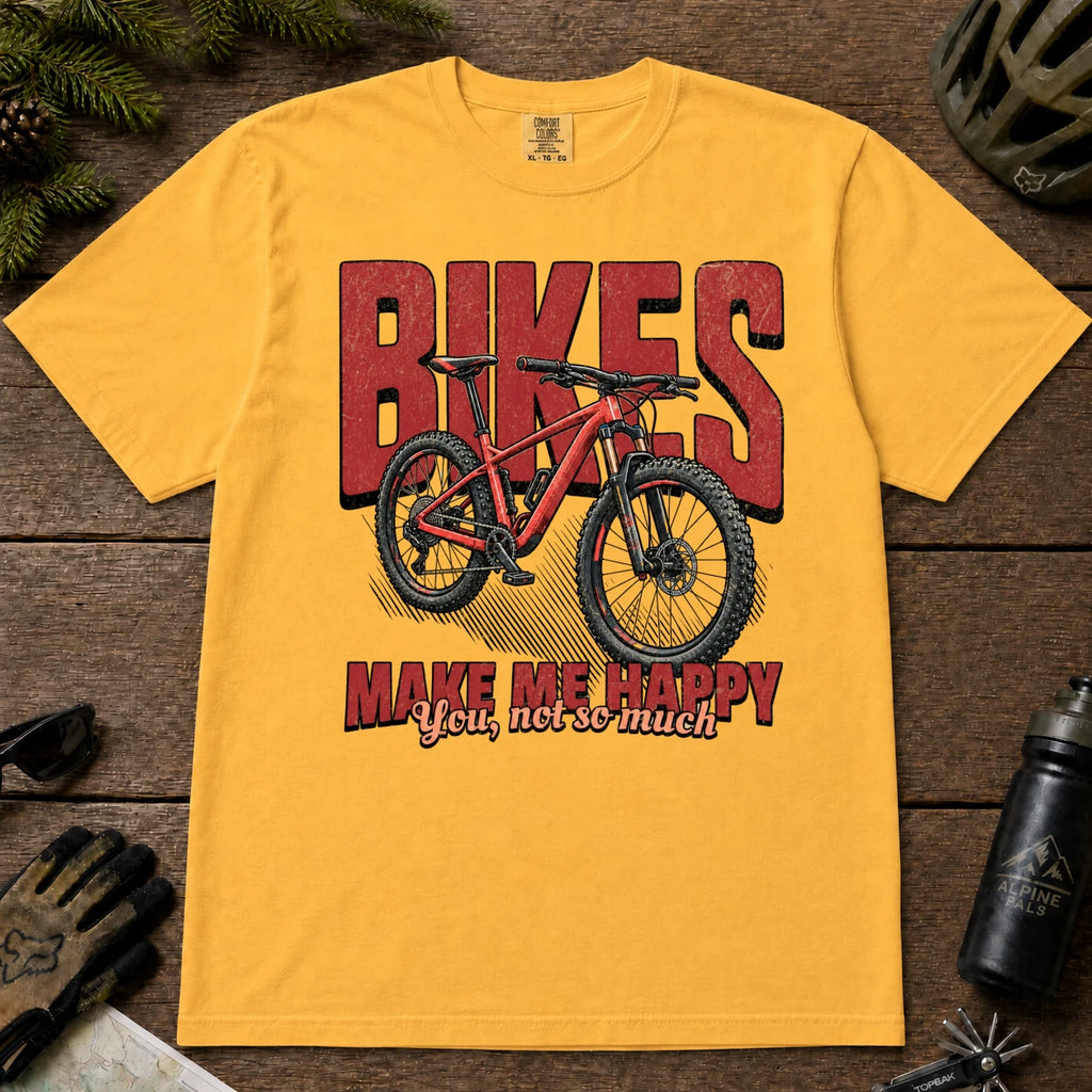 Mustard tee featuring a red mountain bike in front of bold retro “Bikes” lettering with the phrase “Make Me Happy, You Not So Much.”