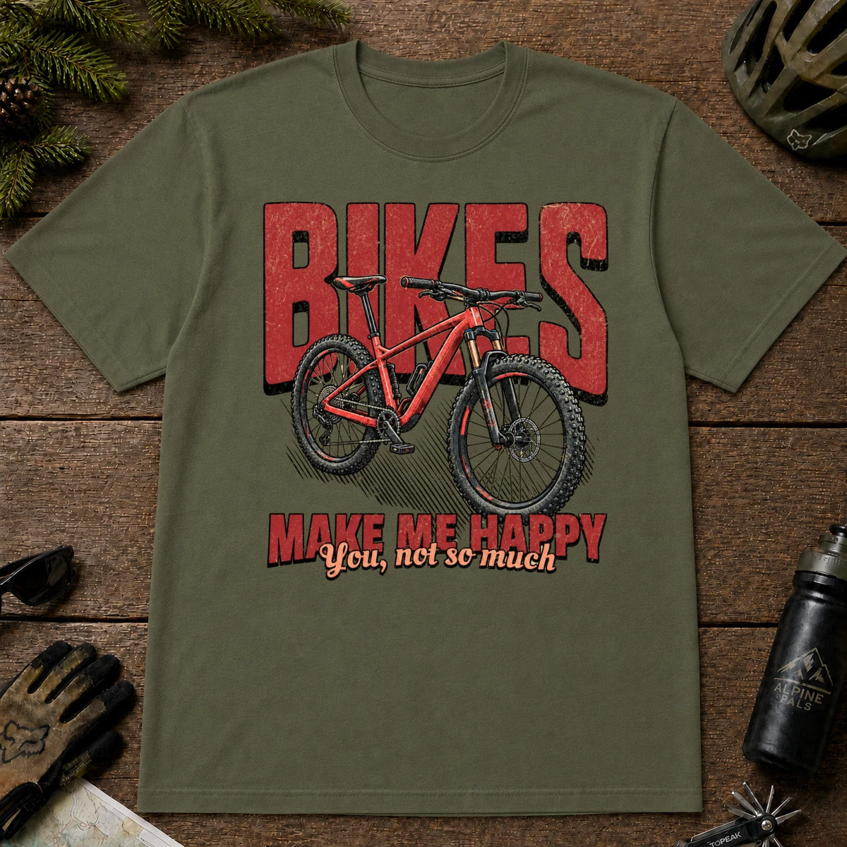 Military Green tee featuring a red mountain bike in front of bold retro “Bikes” lettering with the phrase “Make Me Happy, You Not So Much.”