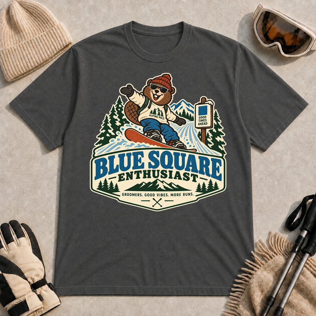 Dark Heather Gray tee featuring a cheerful bear snowboarding past a blue-square trail sign above the phrase “Blue Square Enthusiast” with “Groomers. Good Vibes. More Runs.”