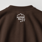 Dark chocolate brown sweatshirt with 'Alpine Pals' logo on a light gray background