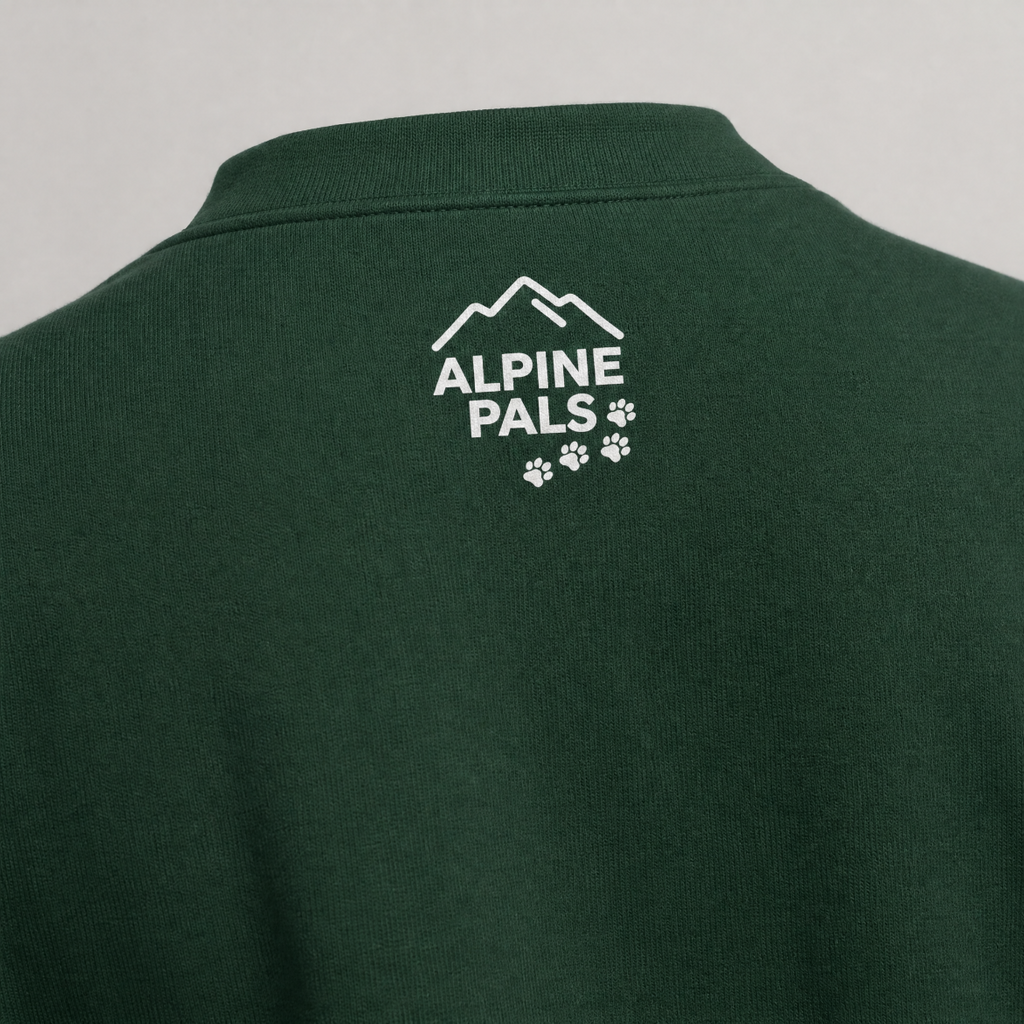 Forest green sweater with 'Alpine Pals' logo on a gray background