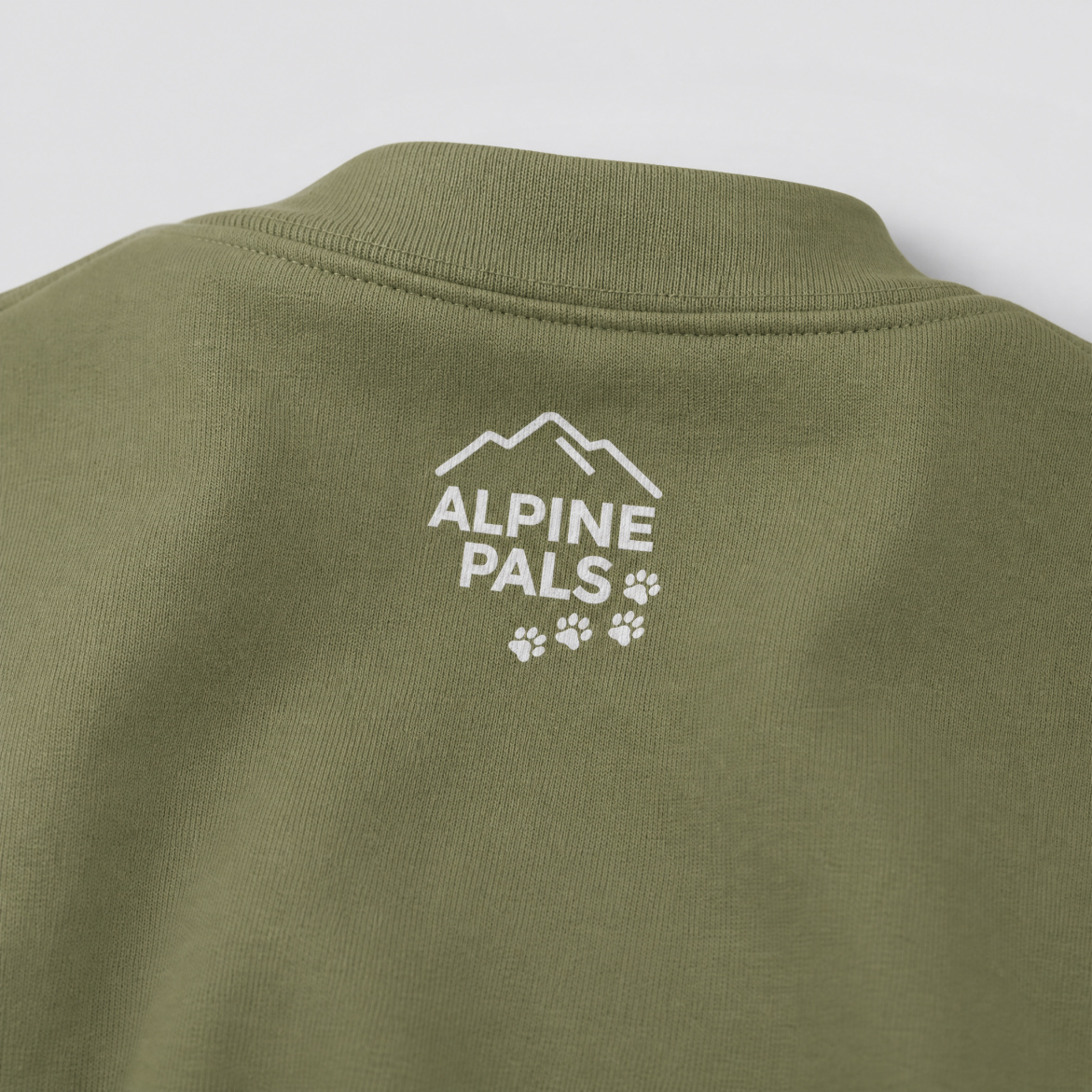 Military green shirt with 'Alpine Pals' logo on a white background