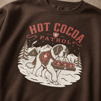 Dark chocolate brown sweatshirt with 'Hot Cocoa Patrol' graphic featuring a dog and hot cocoa mugs.