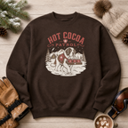 Dark chocolate brown sweatshirt with 'Hot Cocoa Patrol' design on a wooden surface with winter accessories.