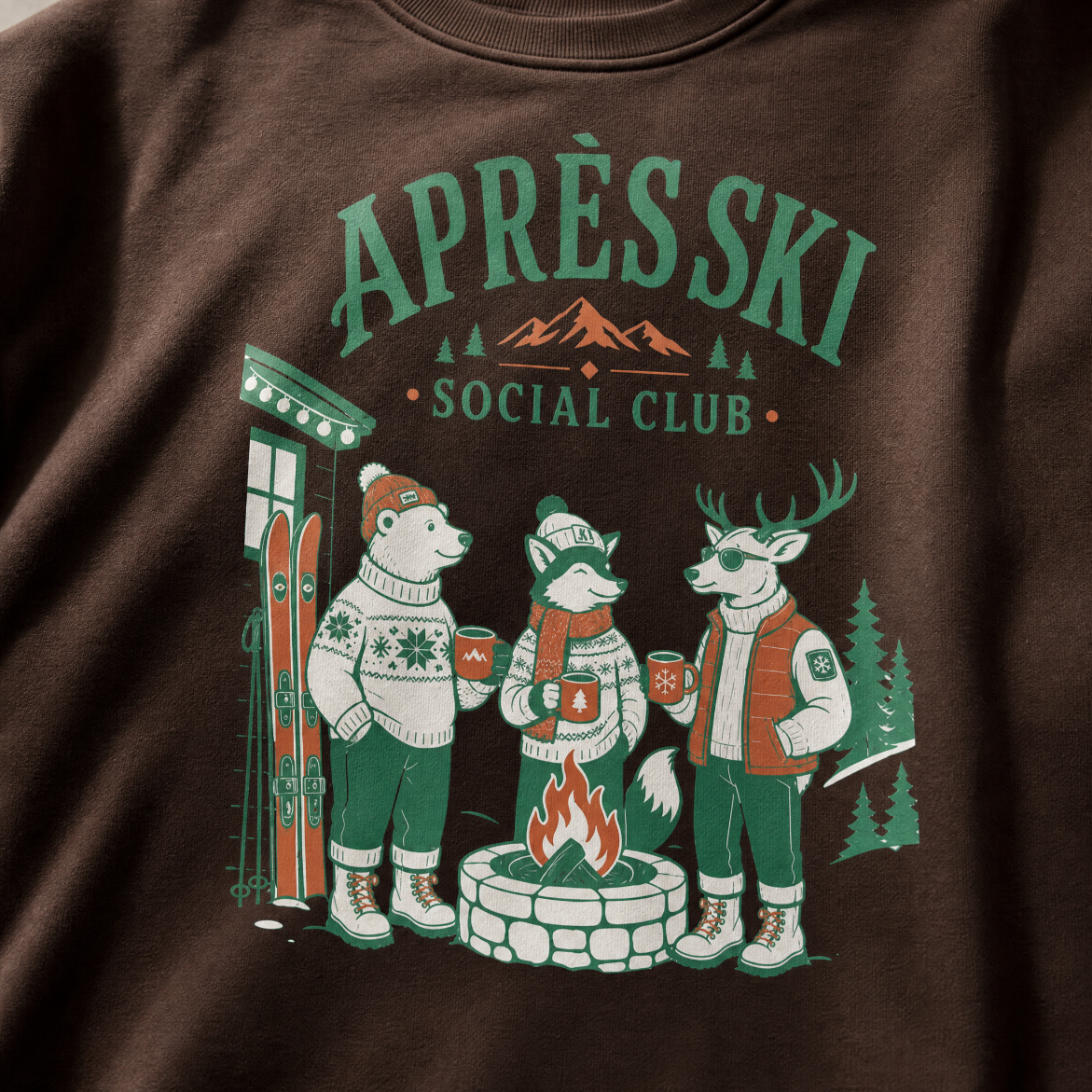 Dark chocolate brown sweatshirt with 'Apres Ski Social Club' graphic featuring animals around a campfire.