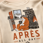 Sand colored sweatshirt with a cat graphic and 'Après All Day' text on a beige background