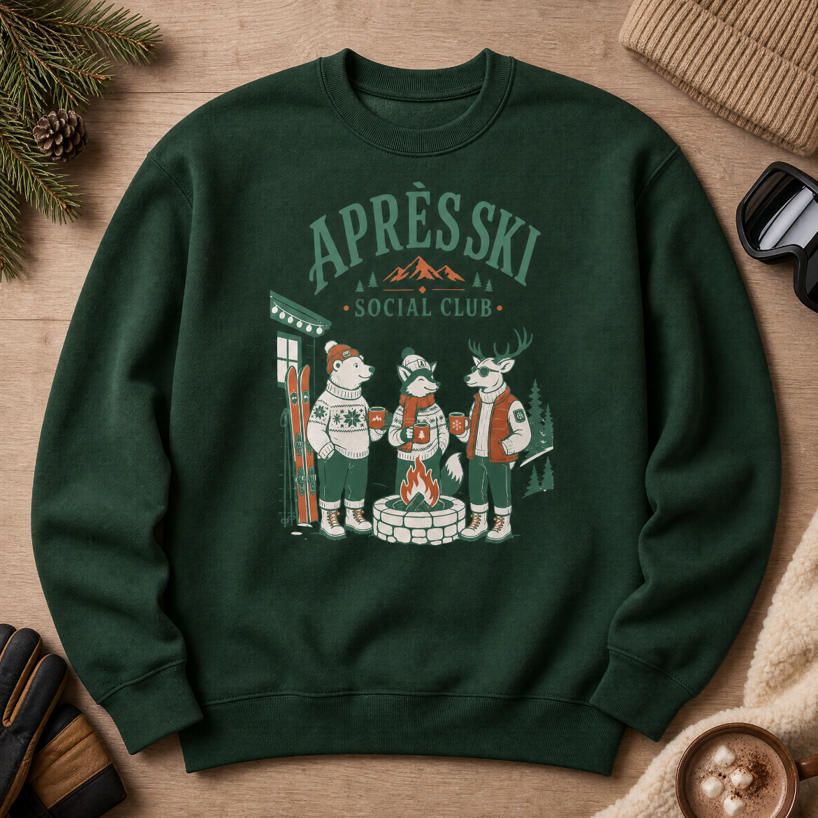 Forest green sweatshirt with 'Après Ski Social Club' design on a wooden surface with winter accessories.