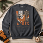 Dark heather gray sweatshirt with a tiger graphic and 'APRES ALL DAY' text on a wooden surface with winter accessories.