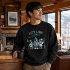 Man wearing a black sweatshirt with 'Lift Line Legends' design in a cozy cabin setting.