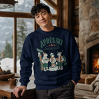 Man wearing a navy blue sweatshirt with 'APRES SKI SOCIAL CLUB' design in a cozy indoor setting.