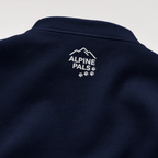 Navy blue sweater with 'Alpine Pals' logo on a light gray background