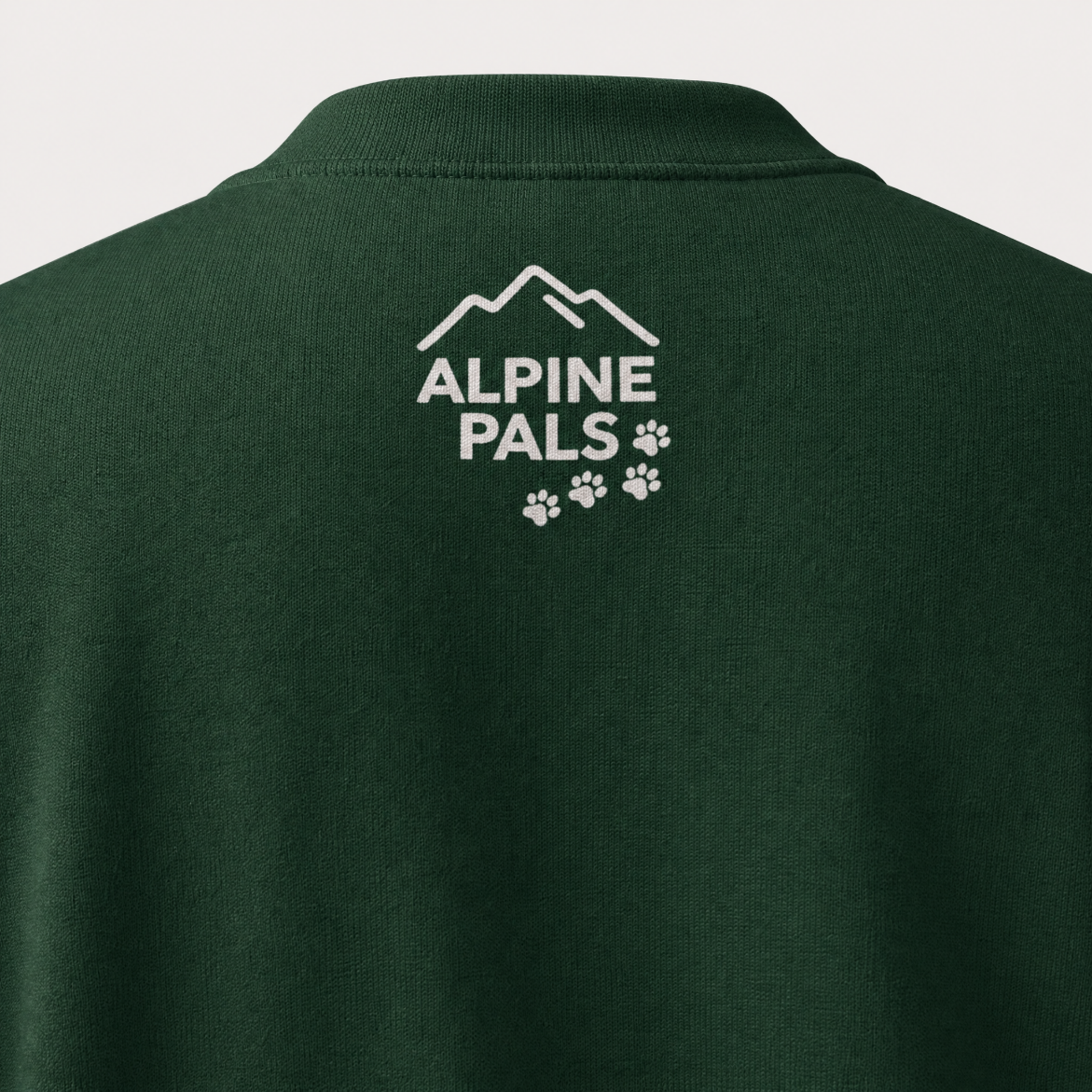 Forest green sweater with 'Alpine Pals' logo on the back