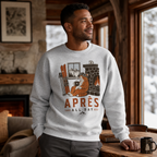 Man wearing a sweater with a cat graphic and 'Après All Day' text in a cozy room.