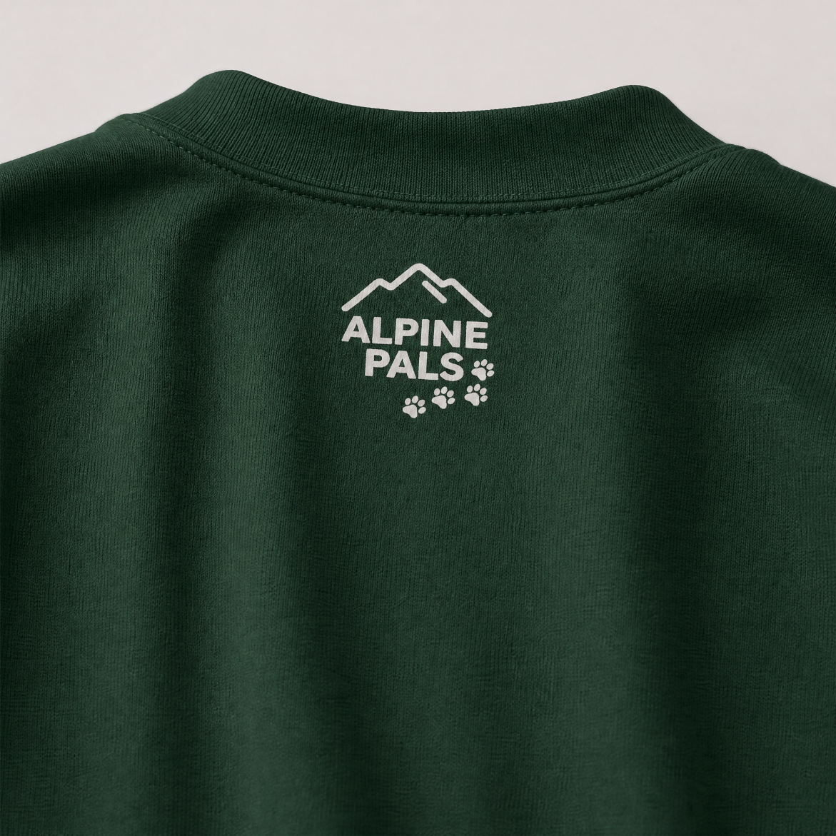 Forest green sweatshirt with 'Alpine Pals' logo on a gray background