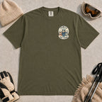 Hemp tee featuring a small left-chest “Family Ski Team” badge with three mountain animals in winter gear.