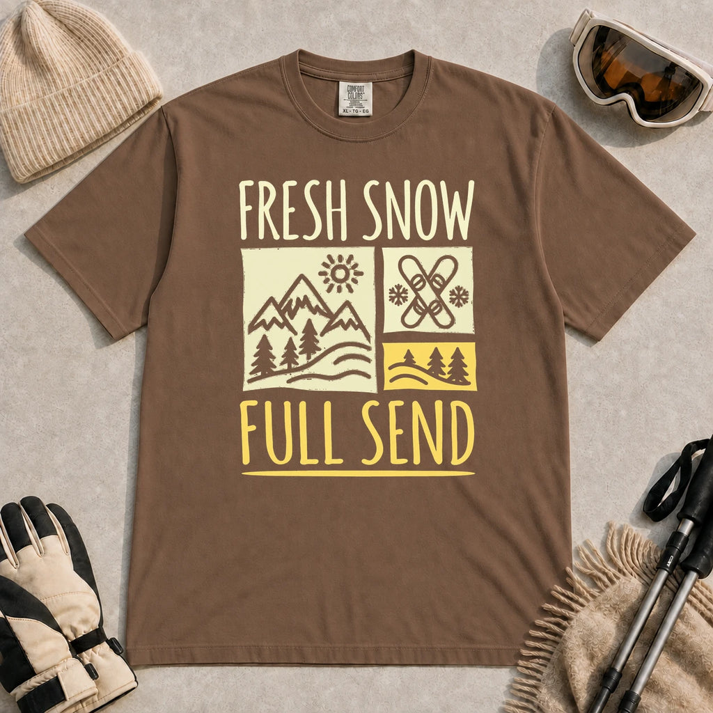 Espresso tee featuring a retro ski and mountain graphic with the phrase “Fresh Snow, Full Send.”