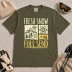 Hemp tee featuring a retro ski and mountain graphic with the phrase “Fresh Snow, Full Send.”