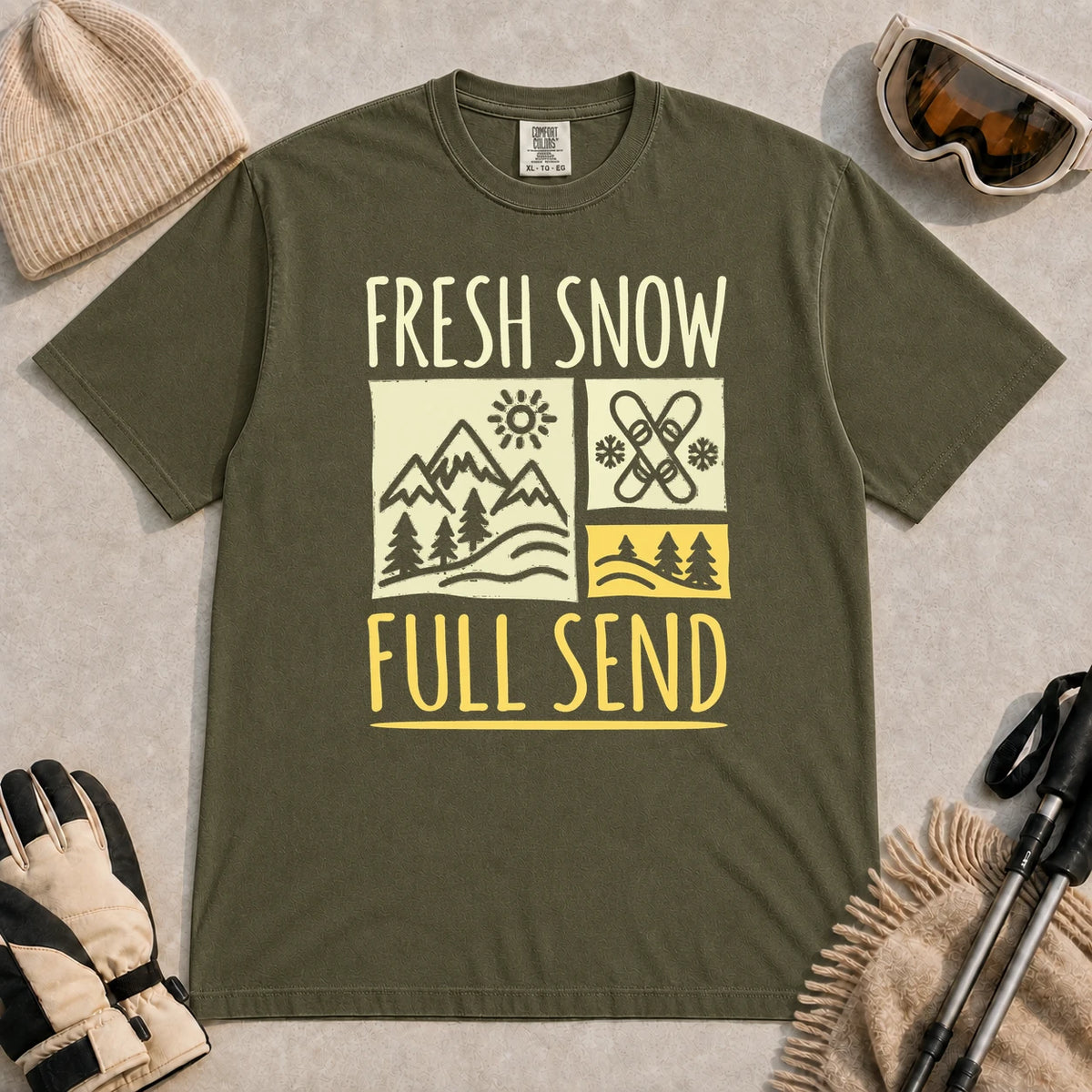 Hemp tee featuring a retro ski and mountain graphic with the phrase “Fresh Snow, Full Send.”