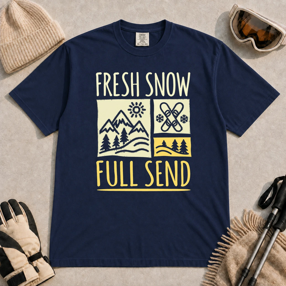 True Navy tee featuring a retro ski and mountain graphic with the phrase “Fresh Snow, Full Send.”