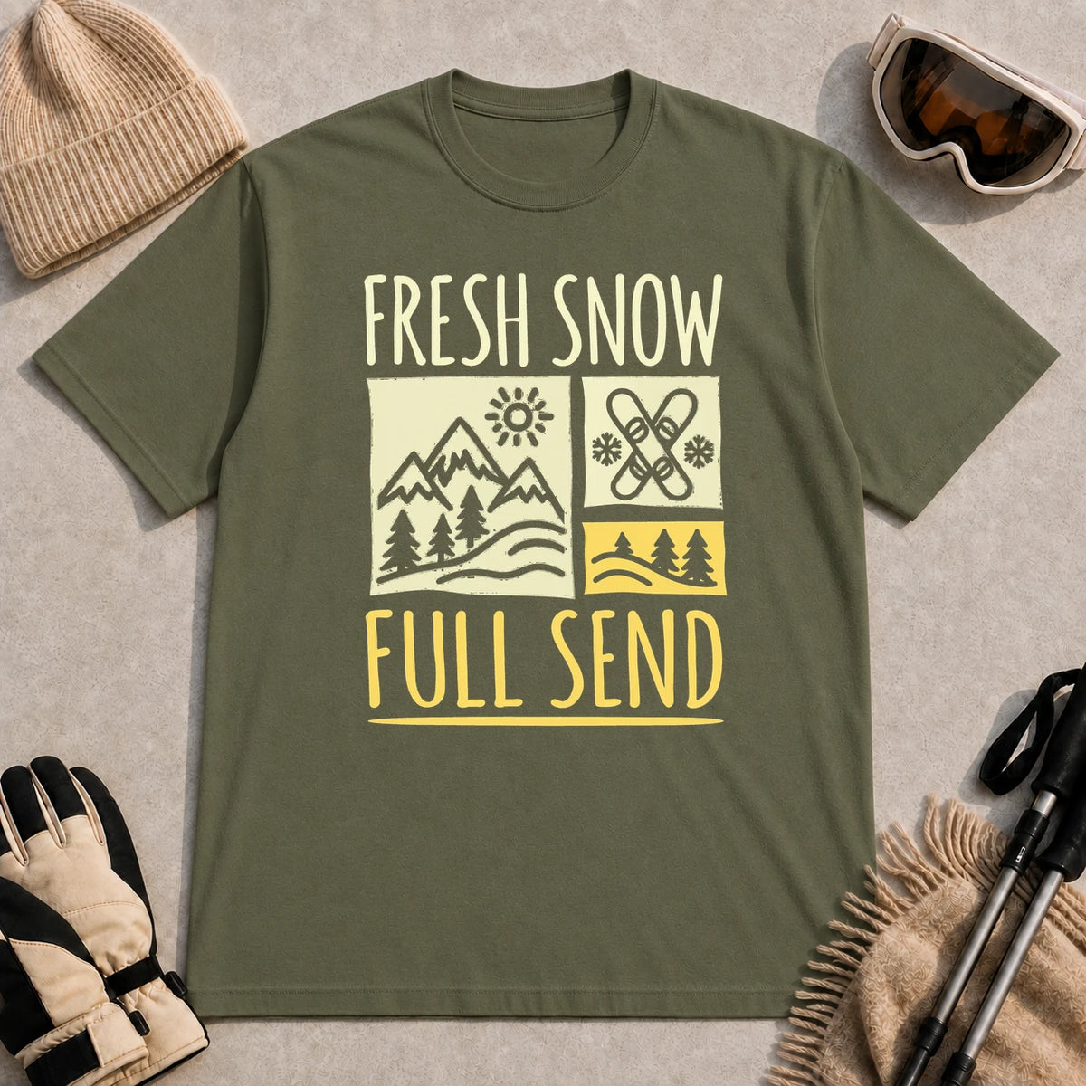 Military Green tee featuring a retro ski and mountain graphic with the phrase “Fresh Snow, Full Send.”