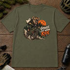 Military Green tee featuring a hyena mountain biking through a spooky Halloween trail scene with a ghost, bats, and orange moon beside the phrase “Ghouls Just Wanna Ride.”