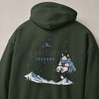 Forest green hoodie with a cat graphic and 'Chairlift Therapy' text on the back, against a neutral background.