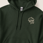 Forest green hoodie with 'Alpine Pals' logo on a light background
