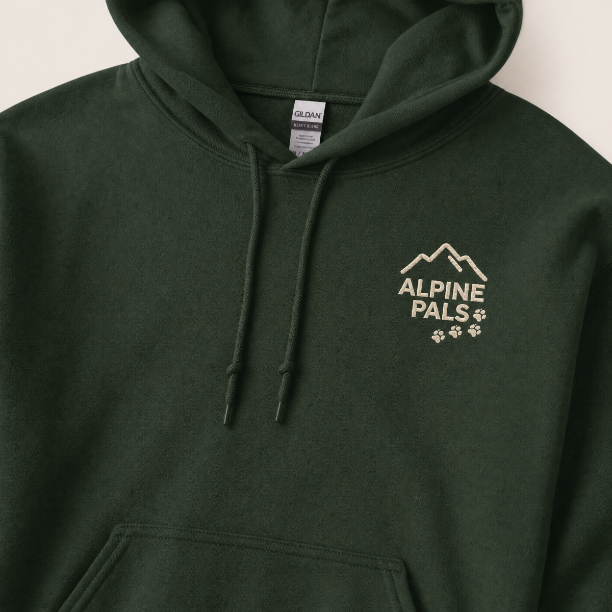 Forest green hoodie with 'Alpine Pals' logo on a light background