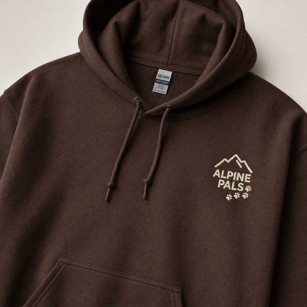 Dark chocolate brown hoodie with 'Alpine Pals' logo on a light gray background