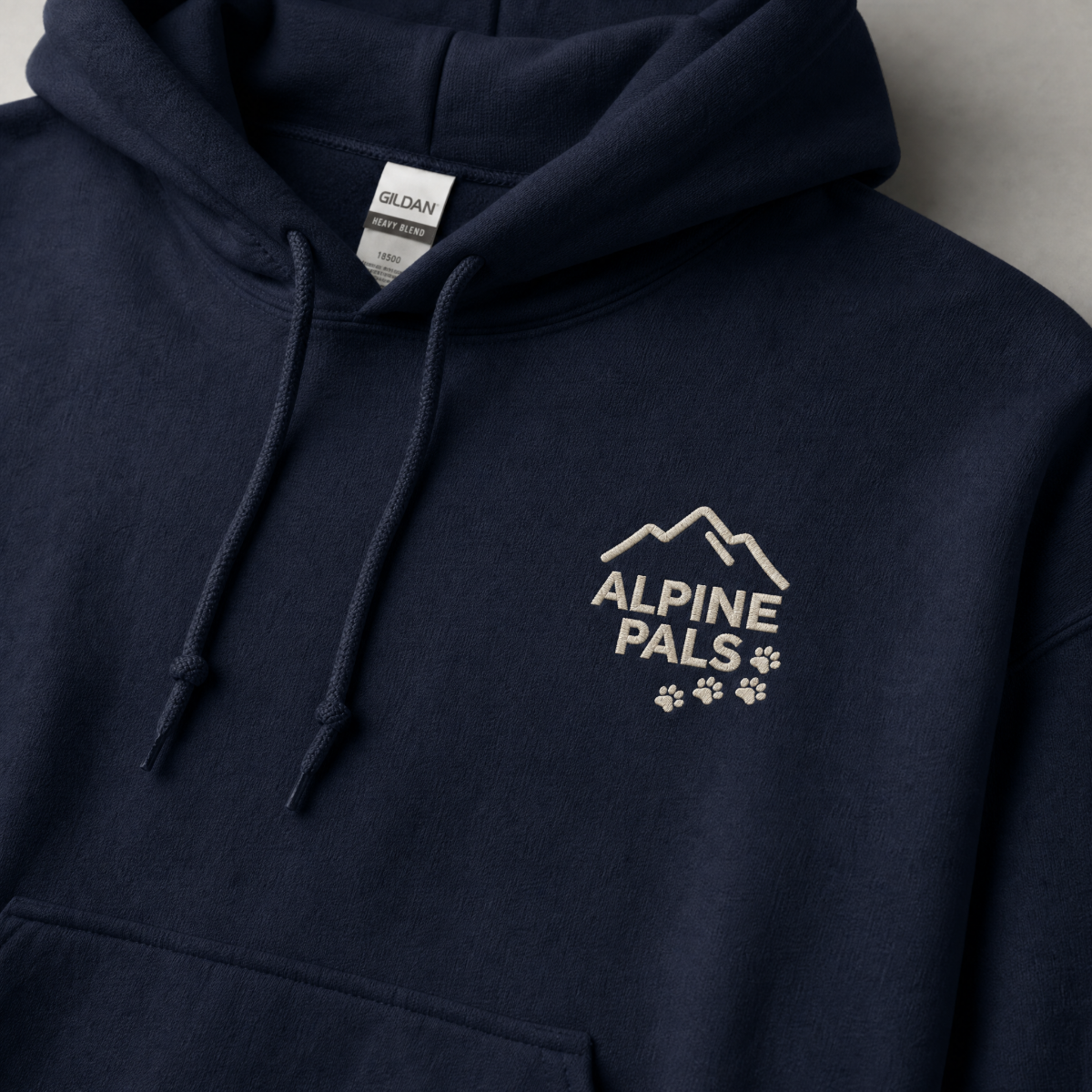 Navy hoodie with 'Alpine Pals' logo on a gray background