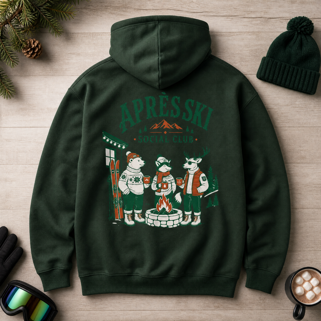 Forest green hoodie with 'Après Ski' design on a wooden surface with winter accessories.
