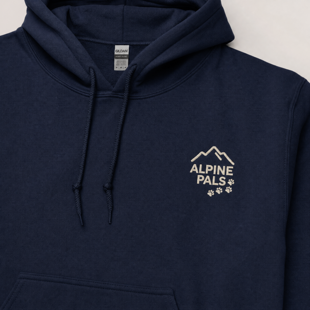 Navy blue hoodie with 'Alpine Pals' logo on a light gray background