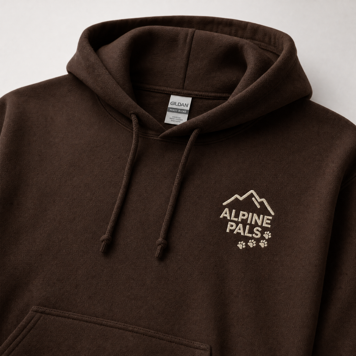 Dark chocolate brown hoodie with 'Alpine Pals' logo on a white background