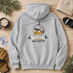 Sport grey hoodie with a ski lift graphic and text on a wooden surface with winter accessories.