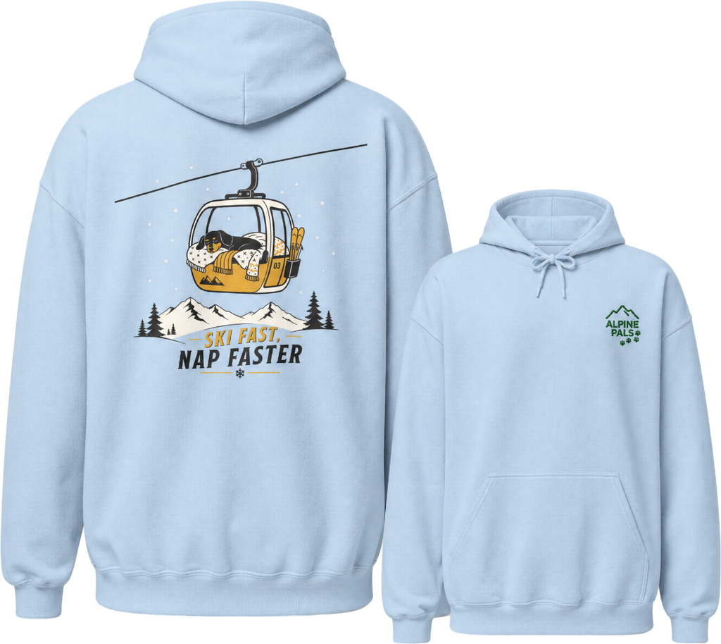 Light blue hoodie with a graphic of a dog in a ski lift and text 'Ski Fast Nap Faster' on the back, with a smaller logo on the chest.
