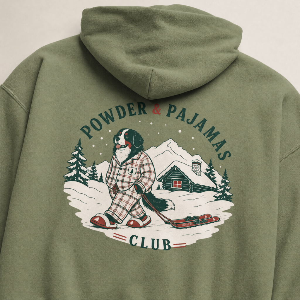 Military green hoodie with a graphic of a dog in pajamas and text 'Powder & Pajamas Club' on the back.