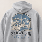 Sport grey hoodie with a graphic of a dog in bed and 'Snowed In & Loving It' text on the back.