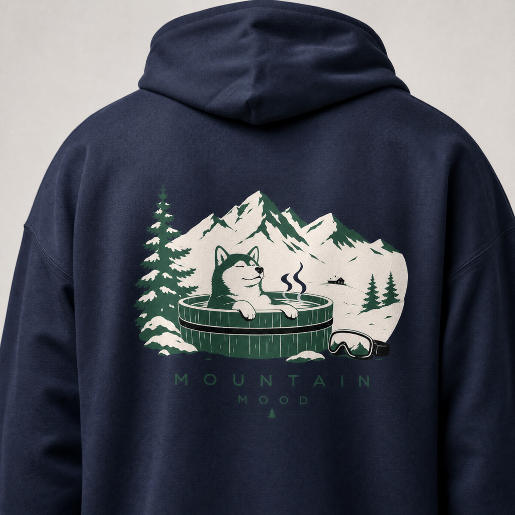 Navy blue hoodie with a graphic of a dog in a hot tub surrounded by mountains and trees on the back.
